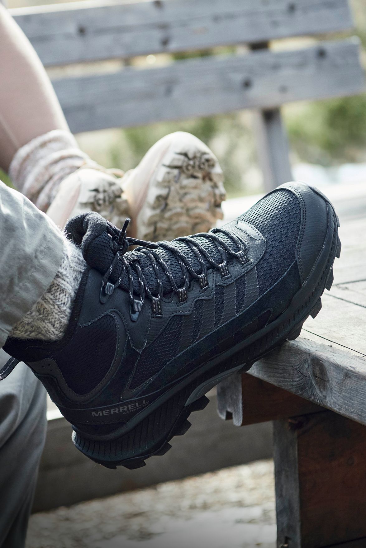 Man in woods wearing Merrell hiking boots